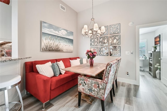 dining space featuring breakfast area and hardwood / wood-style flooring