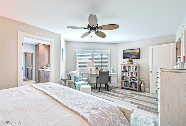 bedroom featuring ceiling fan, connected bathroom, and light hardwood / wood-style flooring