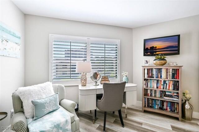 sitting room featuring light hardwood / wood-style flooring