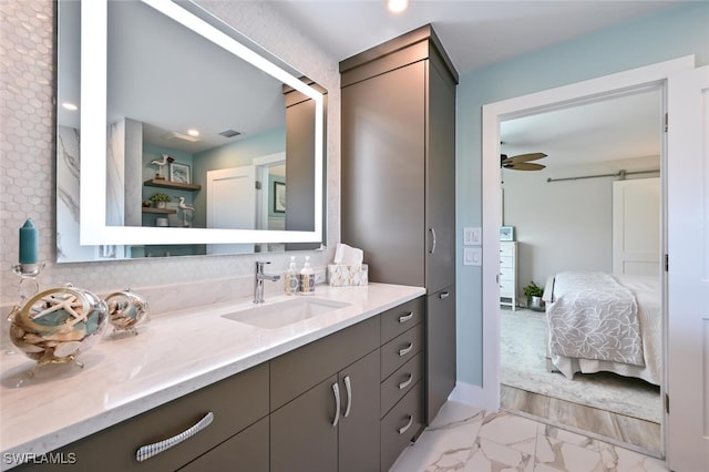 bathroom with vanity and ceiling fan