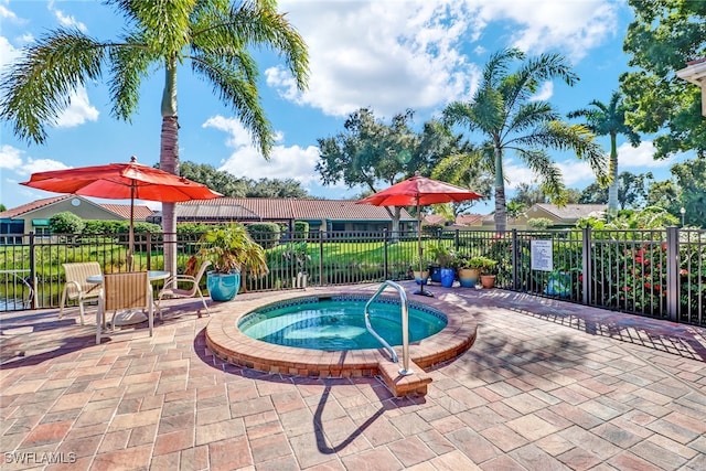 view of pool featuring a community hot tub and a patio