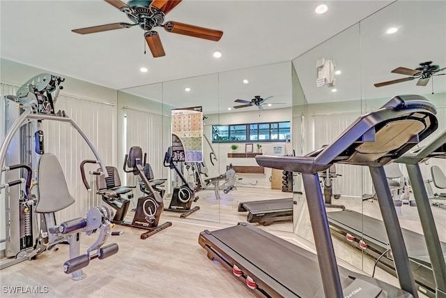 exercise room with light hardwood / wood-style floors