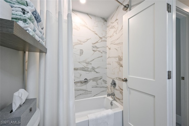 bathroom with shower / bath combo with shower curtain