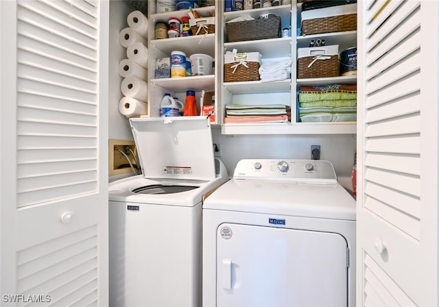 washroom with washing machine and clothes dryer