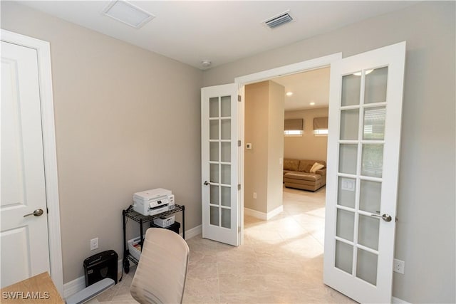 office space featuring french doors, visible vents, and baseboards