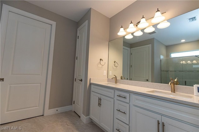 bathroom featuring double vanity, a sink, visible vents, and a shower stall