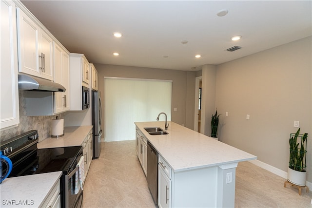 kitchen featuring white cabinetry, appliances with stainless steel finishes, sink, and a kitchen island with sink