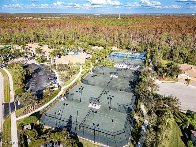 birds eye view of property with a view of trees