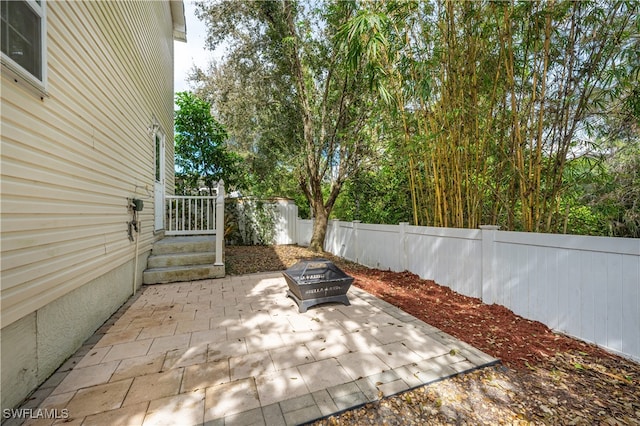 view of patio featuring a fire pit