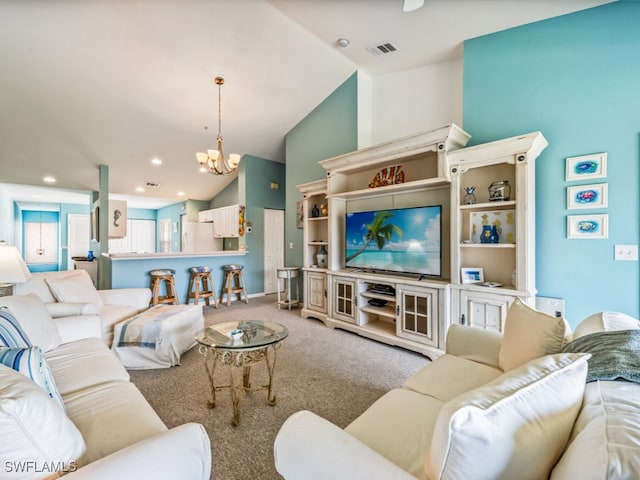 living room featuring light carpet, high vaulted ceiling, and a chandelier