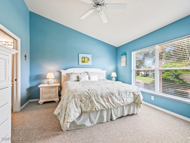 bedroom featuring lofted ceiling, ceiling fan, and carpet