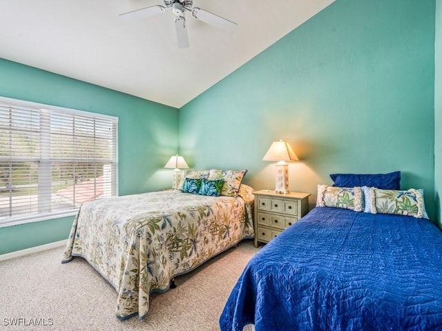 carpeted bedroom with ceiling fan and lofted ceiling