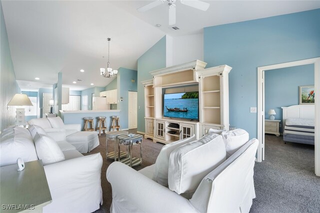 carpeted living room featuring ceiling fan with notable chandelier and high vaulted ceiling