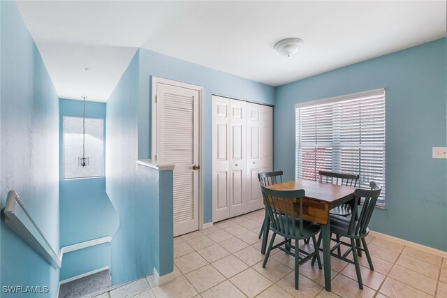 dining room featuring light tile patterned floors and a healthy amount of sunlight