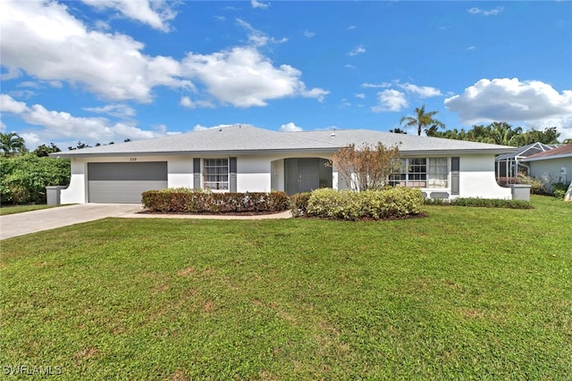 single story home featuring a garage and a front lawn