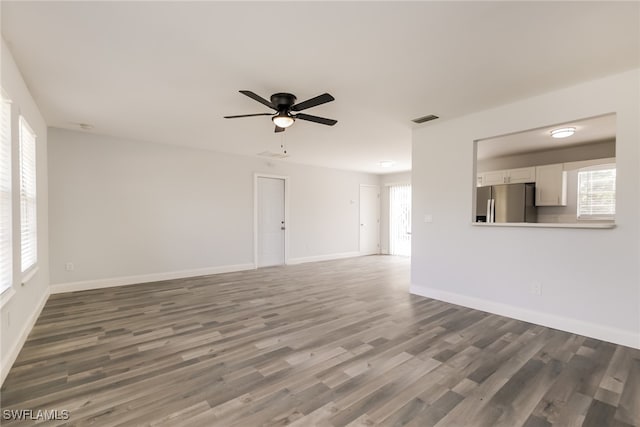 unfurnished room featuring wood-type flooring and ceiling fan