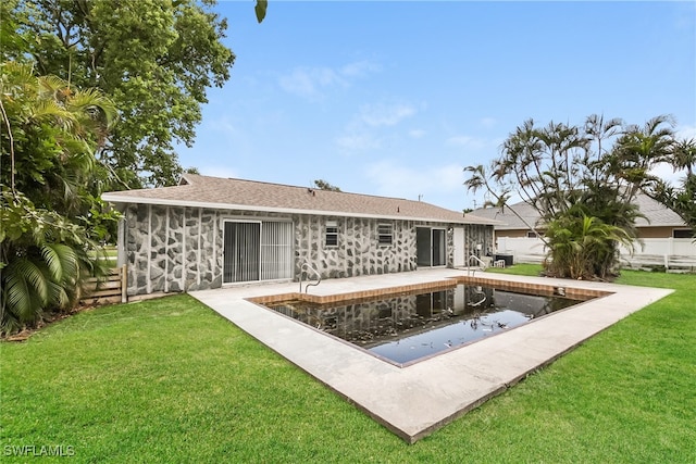 back of property featuring a yard and a patio area