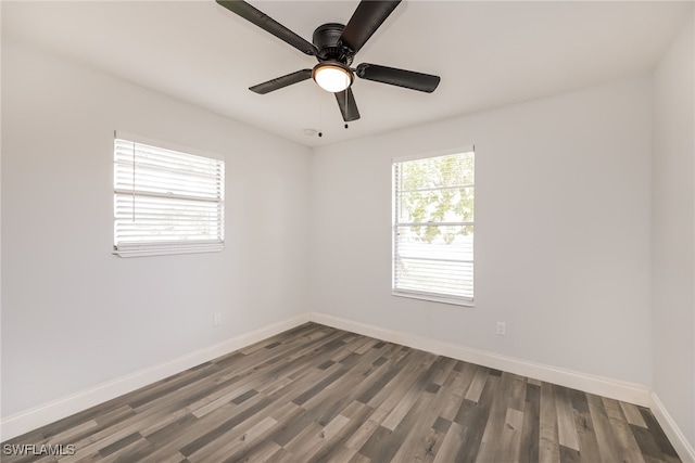 empty room with hardwood / wood-style floors and ceiling fan