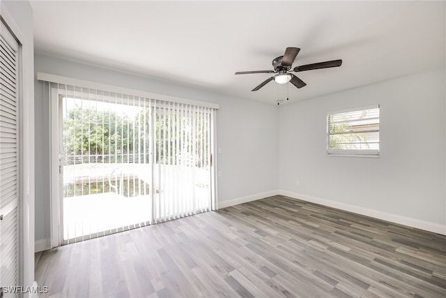 spare room featuring hardwood / wood-style floors and ceiling fan