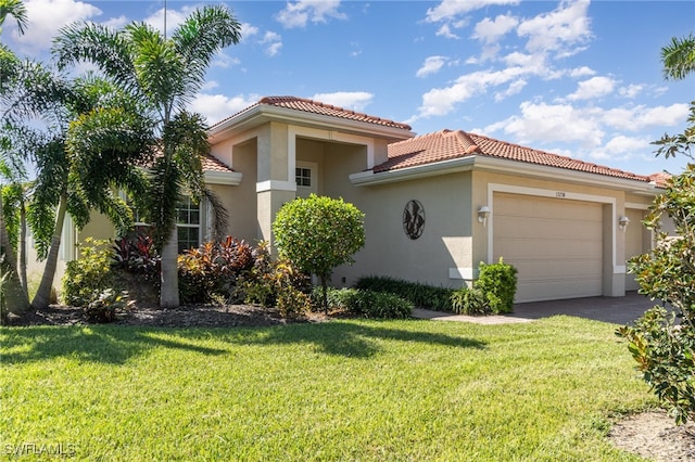 view of front facade with a front yard and a garage