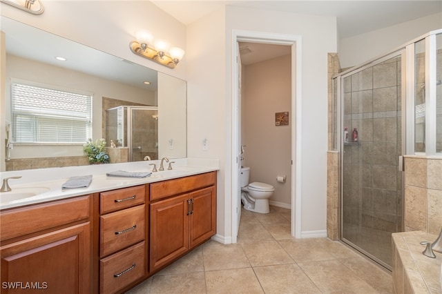 bathroom with toilet, an enclosed shower, vanity, and tile patterned floors