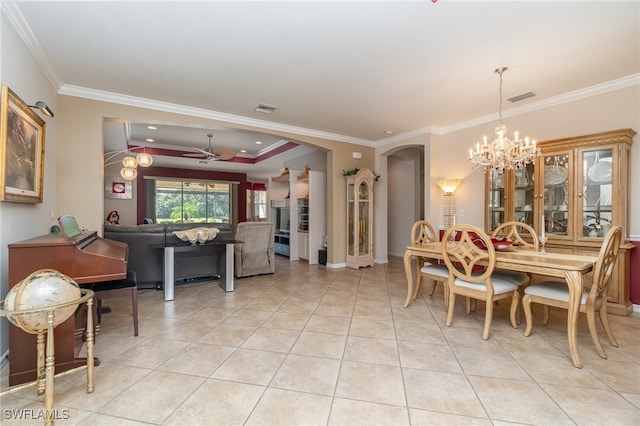 dining room with ornamental molding, ceiling fan with notable chandelier, and light tile patterned floors