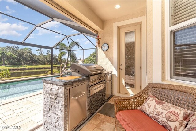 view of patio featuring glass enclosure, a water view, a grill, area for grilling, and an outdoor pool