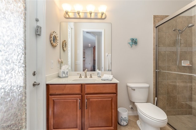 bathroom with toilet, an enclosed shower, vanity, and tile patterned flooring