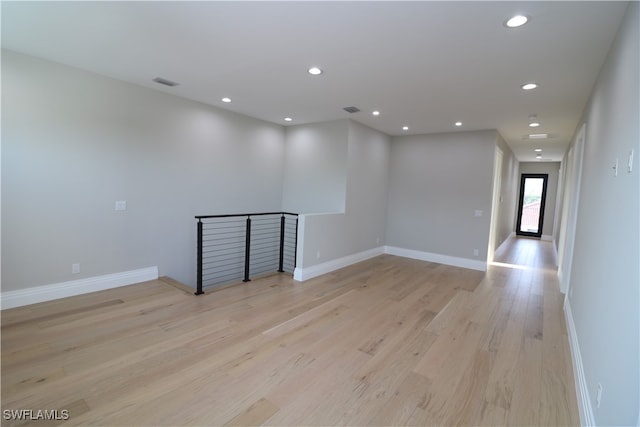 unfurnished room with light hardwood / wood-style floors