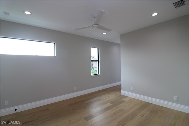 spare room with light hardwood / wood-style flooring and ceiling fan