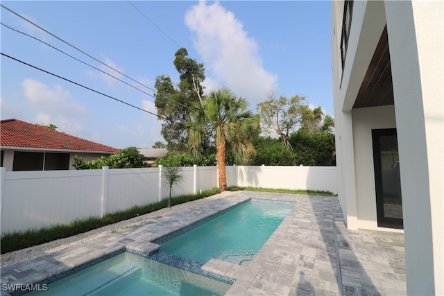 view of pool featuring a patio