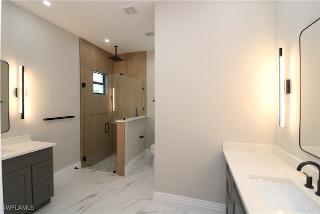 bathroom with vanity, walk in shower, and toilet