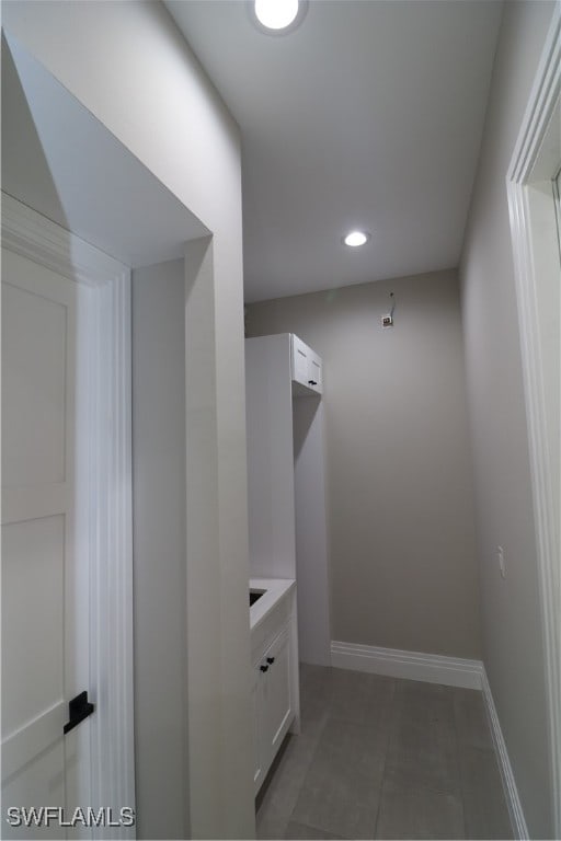 spacious closet featuring dark tile patterned floors