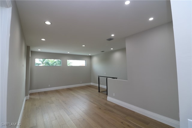 unfurnished room with light wood-type flooring