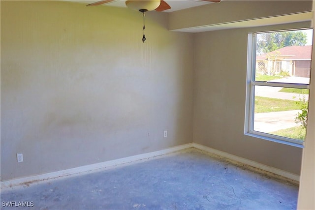 unfurnished room featuring concrete flooring and ceiling fan