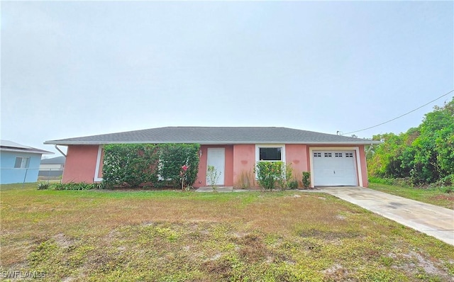 single story home with a garage and a front yard