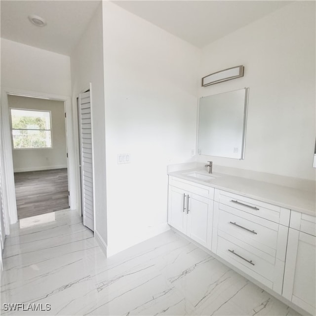 bathroom featuring vanity and hardwood / wood-style flooring