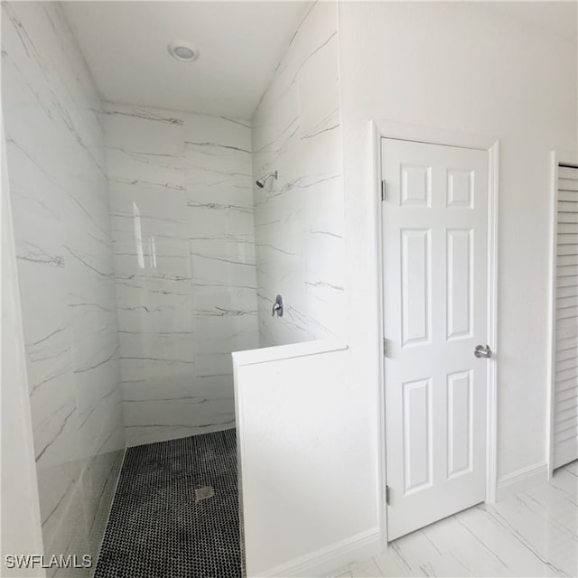 bathroom with tiled shower