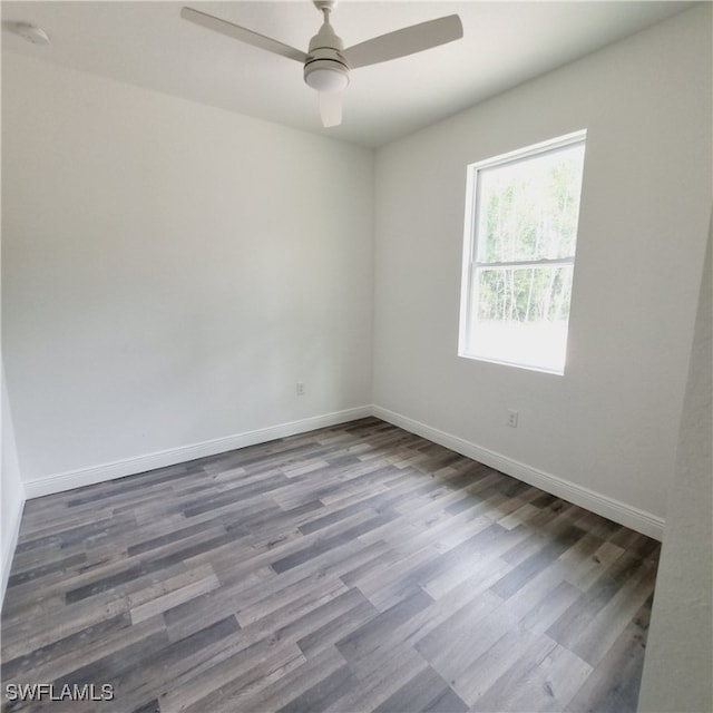 spare room with hardwood / wood-style floors and ceiling fan