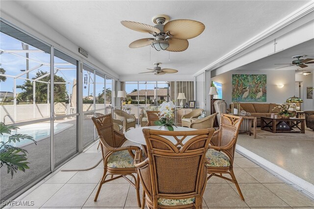 sunroom / solarium with ceiling fan