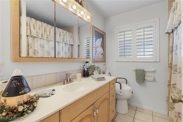 bathroom featuring vanity, toilet, and tile patterned floors