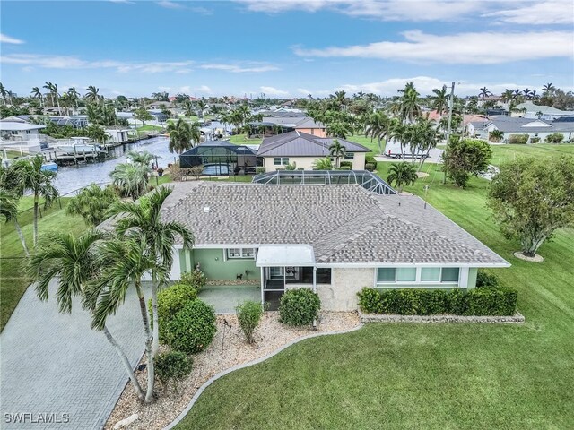 drone / aerial view with a water view