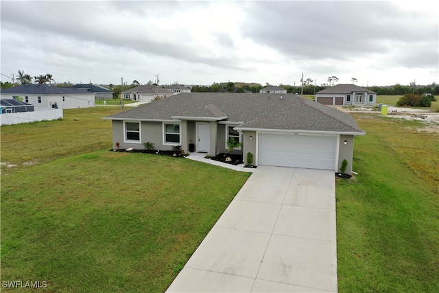 single story home featuring a front yard and a garage