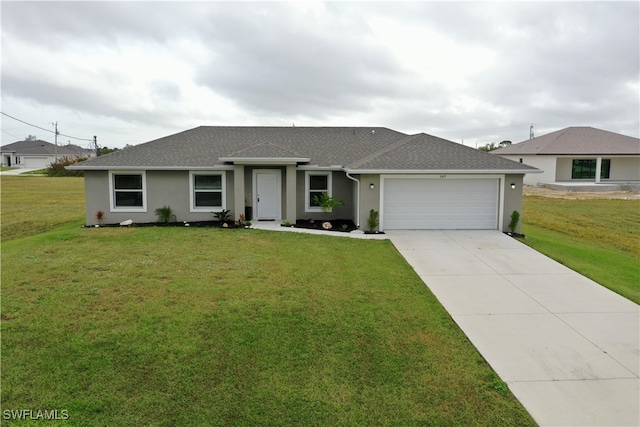 ranch-style home featuring a front yard and a garage