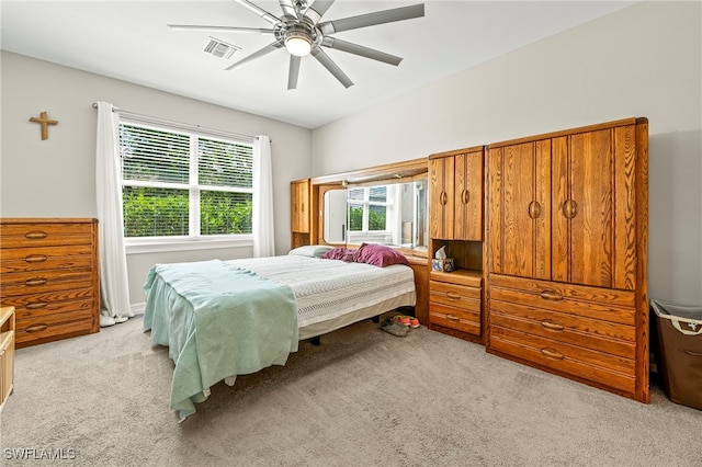 bedroom with light colored carpet and ceiling fan