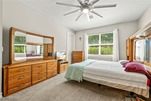 carpeted bedroom with ceiling fan