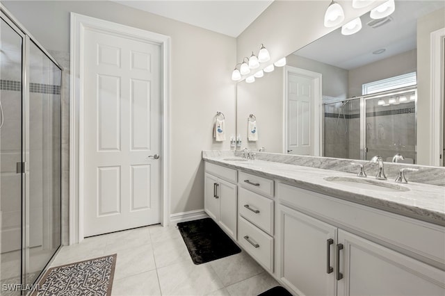 bathroom with vanity, tile patterned floors, and an enclosed shower