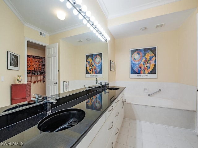 bathroom with vanity, crown molding, a tub to relax in, and tile patterned floors