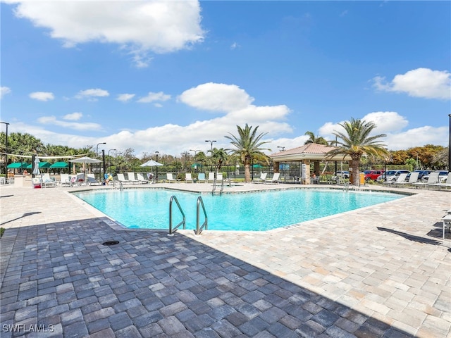 view of swimming pool with a gazebo and a patio area