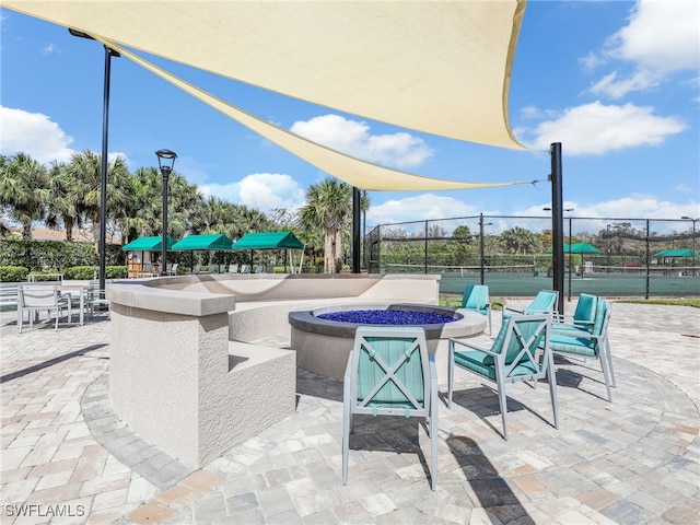 view of patio / terrace featuring an outdoor fire pit